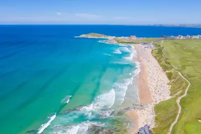 an aerial view of the beach and ocean at Pentire Point - Coastal Penthouse, Beaches, River & Restaurants All Within Short Walk in Newquay
