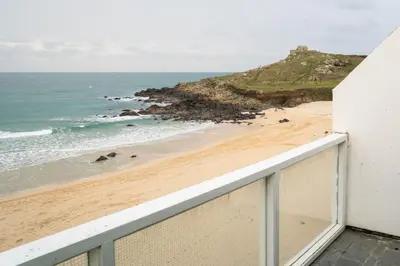 a balcony with a view of the beach at 24 Piazza in St Ives
