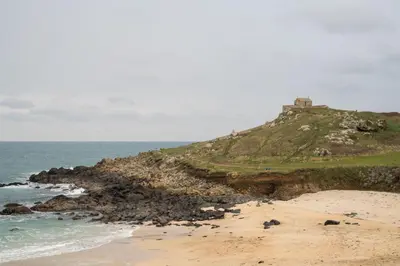 a beach with a house on top of a hill at 24 Piazza in St Ives