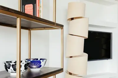a shelf with a mirror and two vases on it at 6 Barnaloft in St Ives