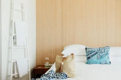 a bedroom with a bed with a pillow and a table at 6 Barnaloft in St Ives