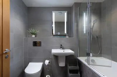 a bathroom with a sink and a toilet and a shower at Seasky in Praa Sands