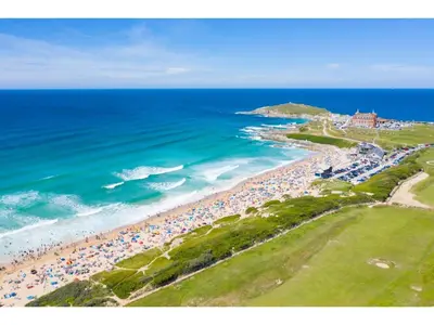 an aerial view of a beach with crowds of people at Modern Apartment Sea Views Private Parking in Newquay