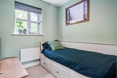 a bedroom with a bed and a window at Modern Townhouse in Penryn with Private Parking in Penryn