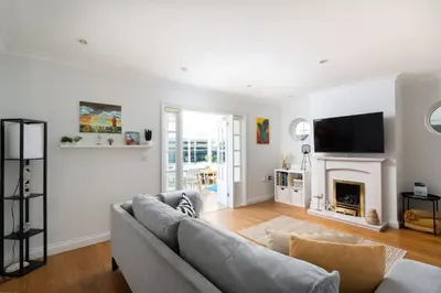 a living room with a couch and a fireplace at Family Home in Newquay Parking 3 mins to Beach in Newquay
