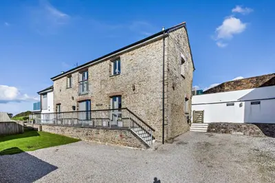 a large brick building with a balcony on it at 5 Bed in St. Issey oc-r4328 in Saint Issey