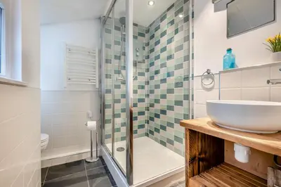 a bathroom with a sink and a shower at 1 Bed in Padstow oc-s30202 in Padstow