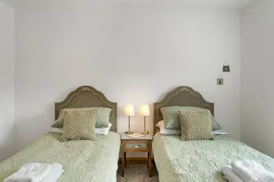 two beds sitting next to each other in a bedroom at Ranalegh Court in Saint Columb Minor