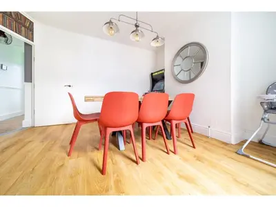 a dining room with a table and four chairs at Spacious Home Private Parking Central Newquay in Newquay