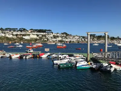 a bunch of boats are docked in a harbor at Apartment Sea Views & Terrace on Waters Edge in Polruan in Polruan
