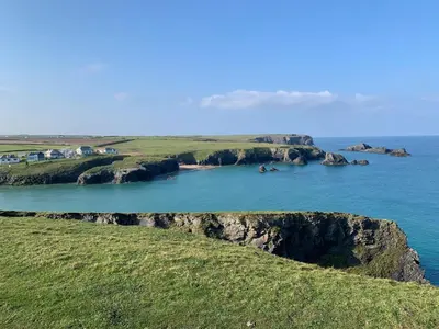 a view of a large body of water with rocks in it at The Lookout in Padstow