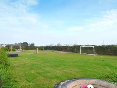 a field with a soccer ball and a goal at Swallows in Mount Hawke