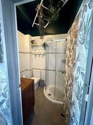 a bathroom with a shower and a toilet at The Fishermans Daughters in Looe