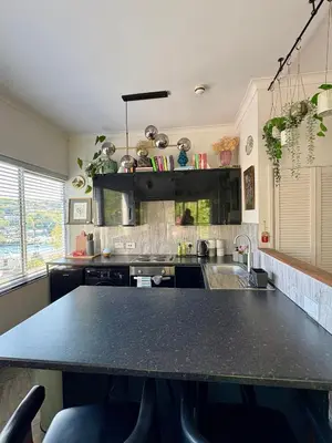 a kitchen with a large black counter top at The Fishermans Daughters in Looe