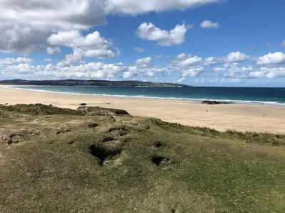 a view of a beach with the ocean in the background at April Cottage in Falmouth