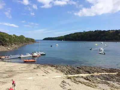 a group of boats are docked on a lake at April Cottage in Falmouth