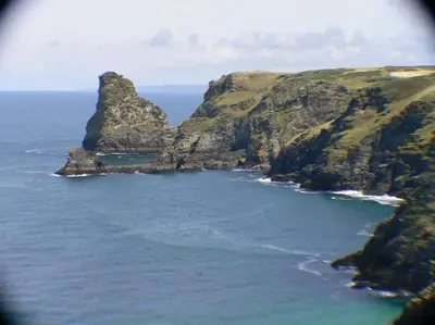 an aerial view of the ocean with a mountain at The Old Barn in Tintagel