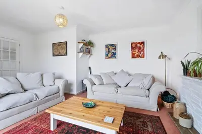 a living room with two couches and a coffee table at Peaceful Home in Looe with Stunning Views in Looe
