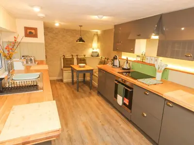 a kitchen with a sink and a counter top at Dowager Cottage in Penryn