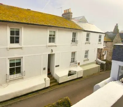 a view of a white house on a street at No 11 Fish Street, St Ives in St Ives