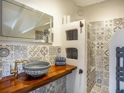 a bathroom with a bowl sink on a wooden counter at Cottage Uk48457 in St Ives