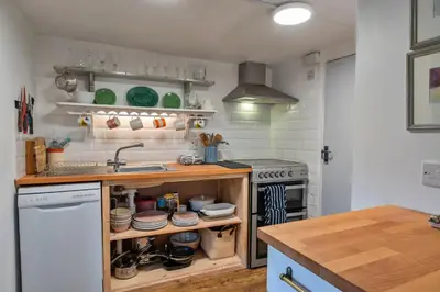 a kitchen with a sink and a counter with dishes at Finest Retreats - The Noel at Lesceave in Praa Sands