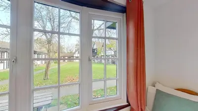 a window with a view of a yard at 14 Tudor Court, Tolroy Manor in Hayle