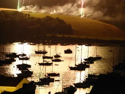 a group of boats in the water at night at Silverspring Hideaways in Constantine