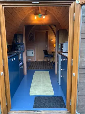 a small kitchen with a blue floor in a house at Silverspring Hideaways in Constantine