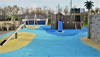 a playground with a slide and a slideintend at Lux Hot Tub Lodge, Retallack nr Padstow and Newquay in Padstow