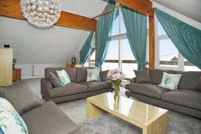a living room with two couches and a coffee table at Lux Hot Tub Lodge, Retallack nr Padstow and Newquay in Padstow