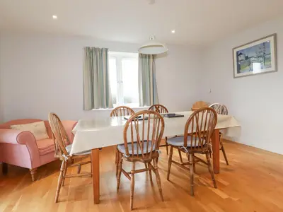 a dining room with a table and chairs at Freefolk in Wadebridge