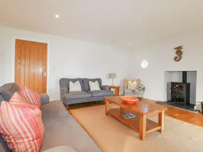 a living room with a couch and a coffee table at Freefolk in Wadebridge