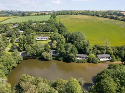an aerial view of a house next to a river at 3 Hedgerows in Looe