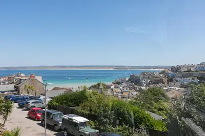a view of the ocean from a parking lot at Captain's Rest in St Ives