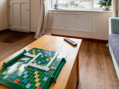a chess board on a table in a living room at Apartment Harbourside Hideaway by Interhome in Mevagissey