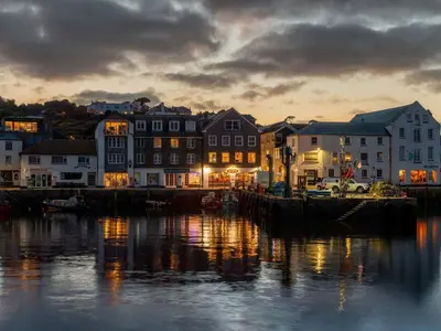 a view of a harbor with buildings and the water at Apartment Harbourside Hideaway by Interhome in Mevagissey