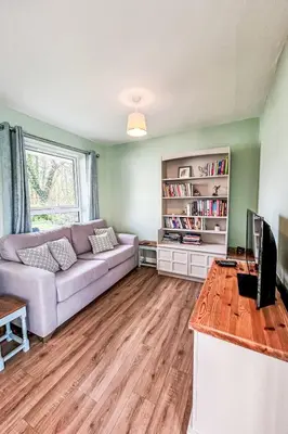 a living room with a couch and a table at Chalet Kingfishers Lodge by Interhome in Liskeard