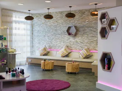 a living room with a couch and a brick wall at Una, Lodge 70 in St Ives