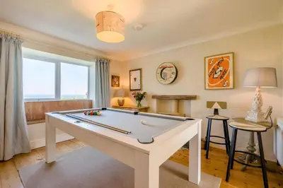 a living room with a pool table in it at 4 Bed in Trevillick oc-m30376 in Tintagel