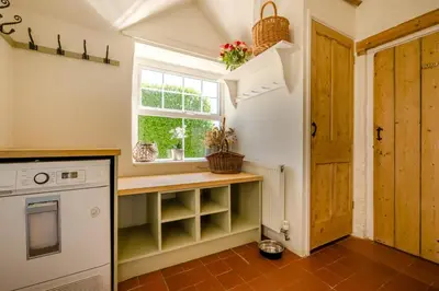 a kitchen with a counter and a window at 4 Bed in Trevillick oc-m30376 in Tintagel