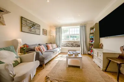 a living room with a couch and a tv at 4 Bed in Trevillick oc-m30376 in Tintagel