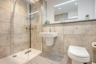 a bathroom with a toilet and a sink and a shower at 2 Bed in Padstow oc-t30497 in Padstow