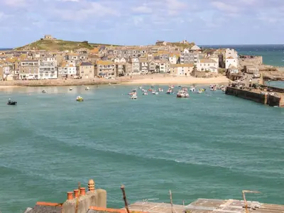a group of boats in the water near a beach at Villa 80 in St Ives