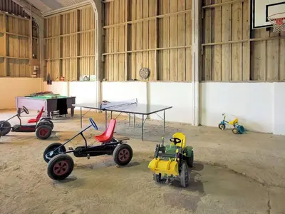 a room with a ping pong table and some toy cars at Bill And Ben's Cottage - Uk48619 in Warbstow