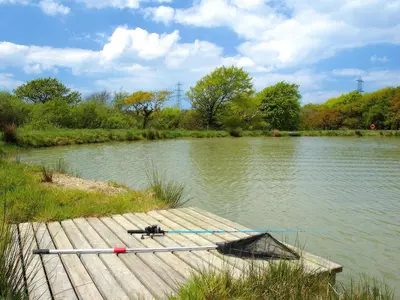 a boat is tied to a dock on a river at Grandma's Cottage - Uk48618 in Warbstow