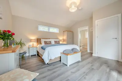 a bedroom with a large bed and a window at 1 Bed in Tresillian oc-p30116 in Saint Clement