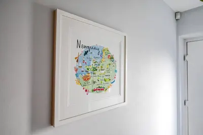 a picture of a map of the world on a wall at Luxury 3-Bed house, Beach 300m, Sleeps 6, Parking in Newquay