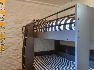 a bunk bed in a bunk bed room with a bunk bed at Byre Cottage in Fowey