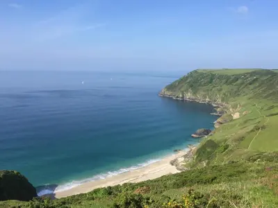 an aerial view of a beach in the ocean at Cornish country house by the coast near Fowey in Lanteglos